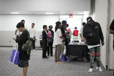 Students dressed professionally, searching for employment at the Albany Internship Job Fair